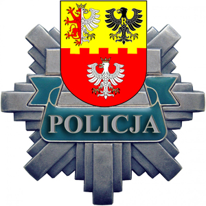 odznaka policyjna z napisem Policja